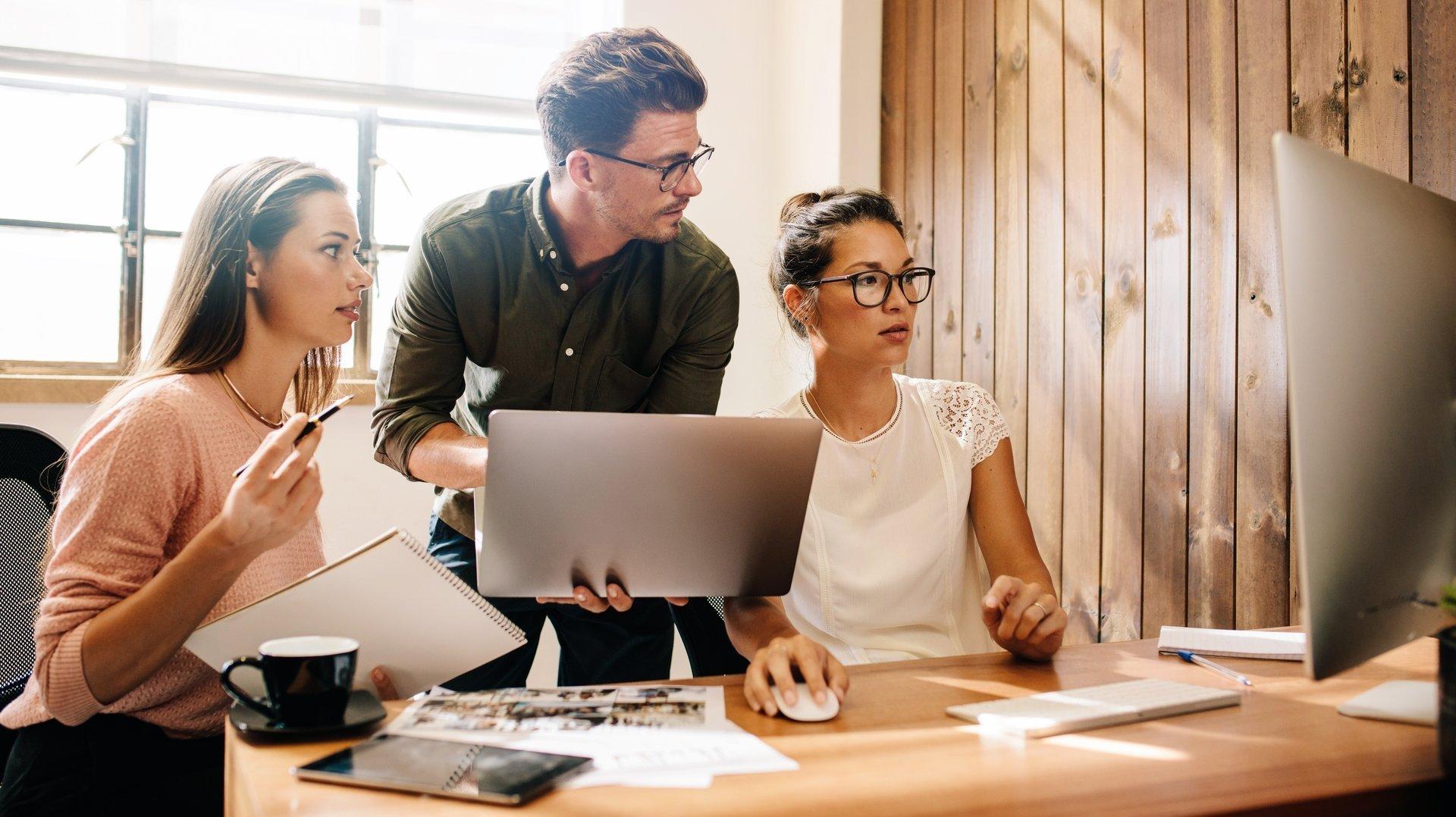 coworkers working together in office