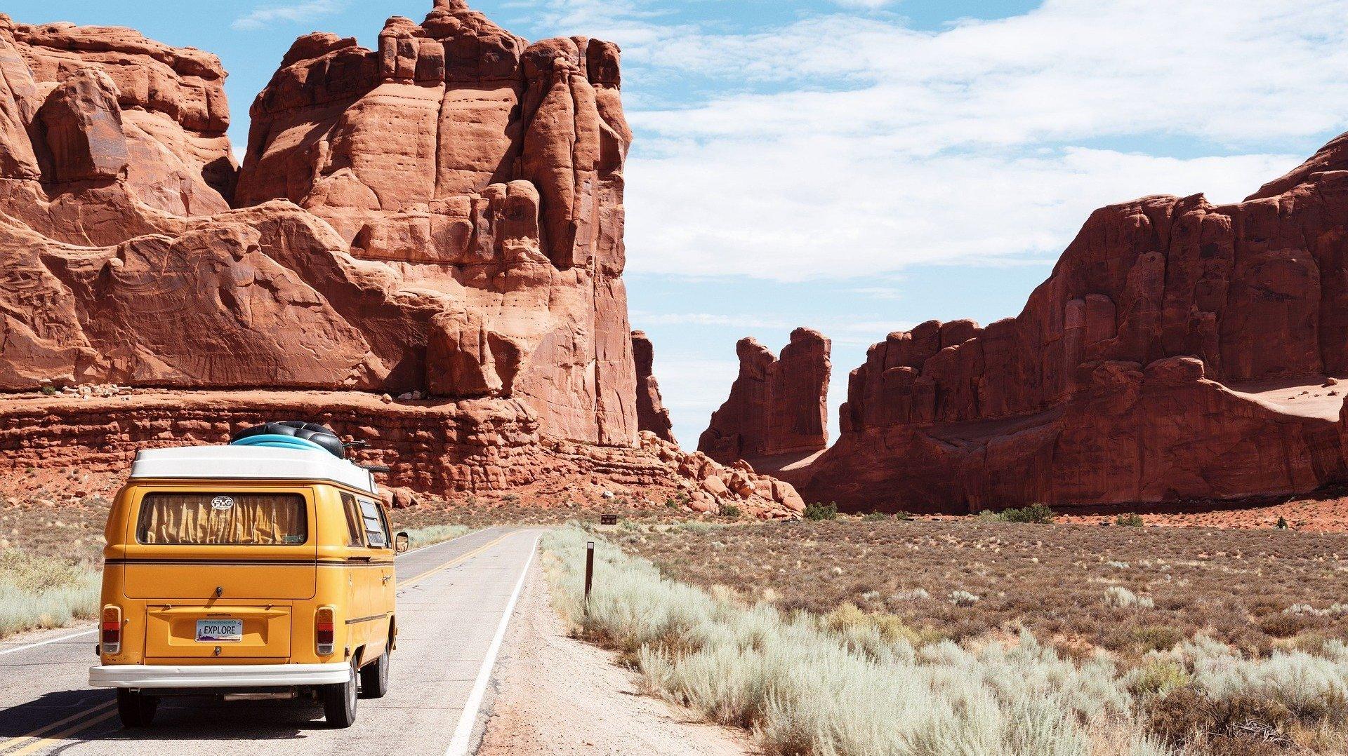 yellow van driving to Arches National Park