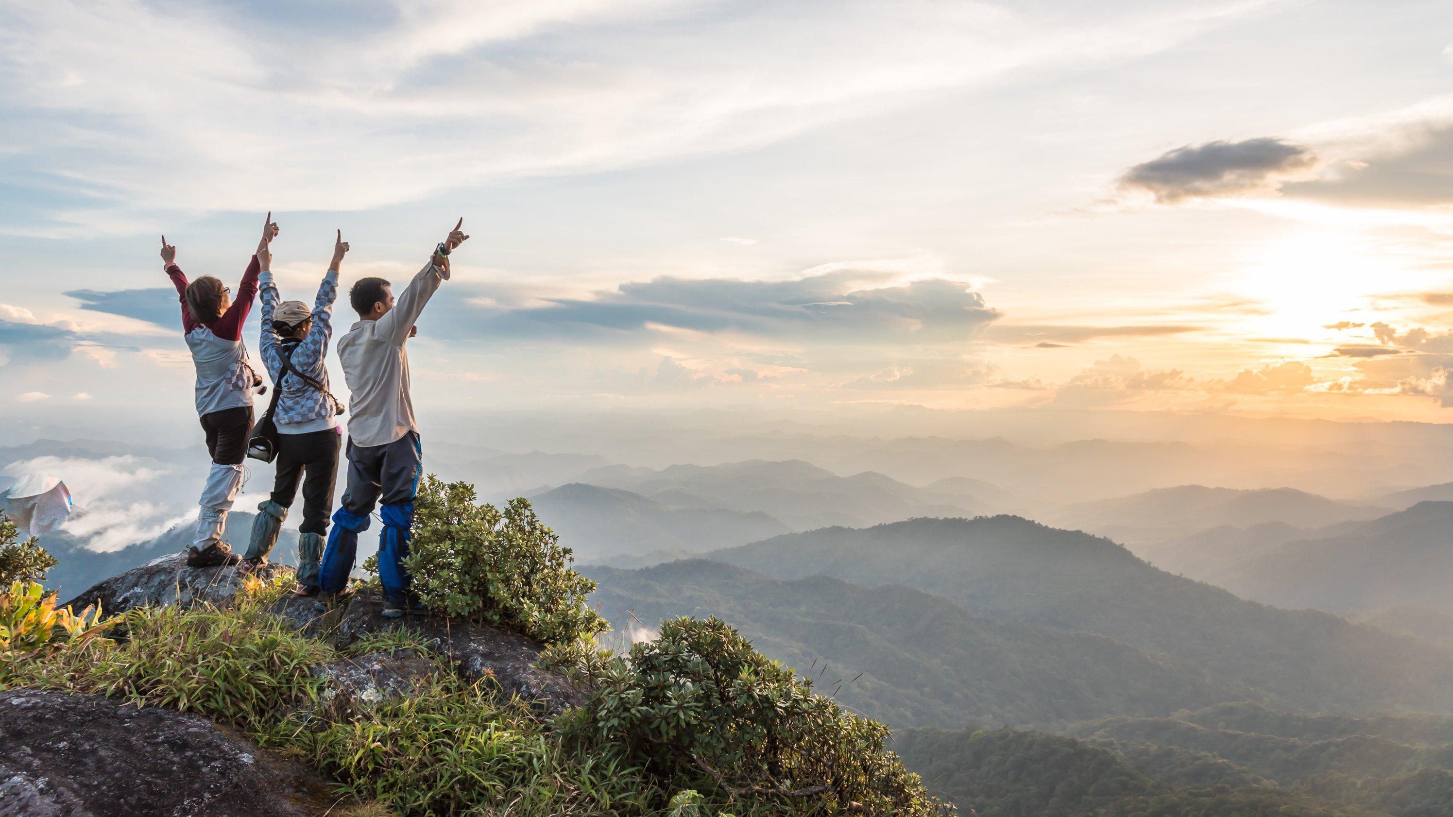 travelers on top of a mountain