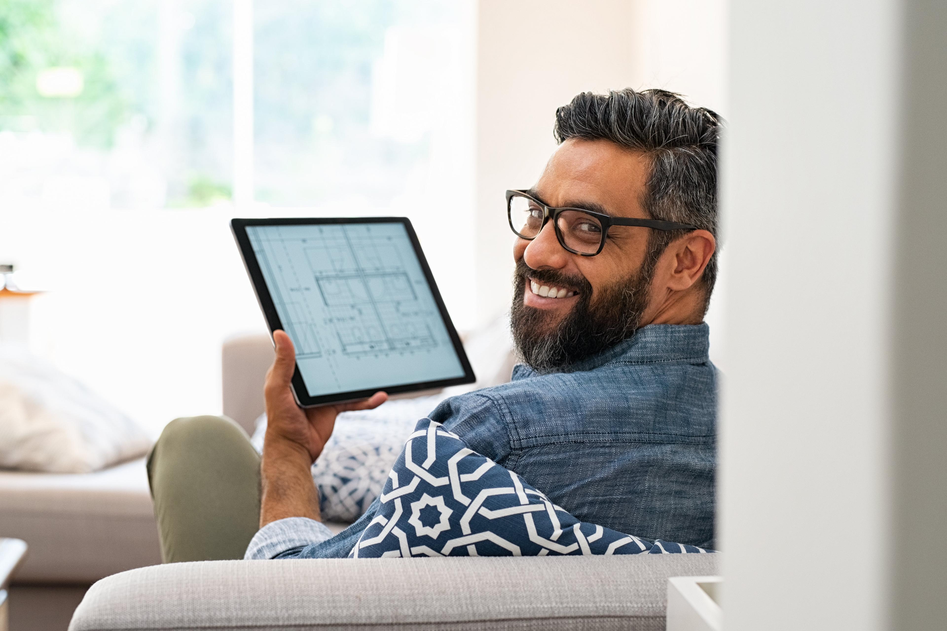 man working on his tablet