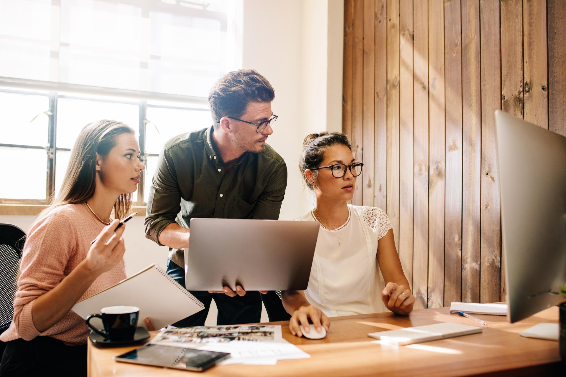 coworkers working together in office